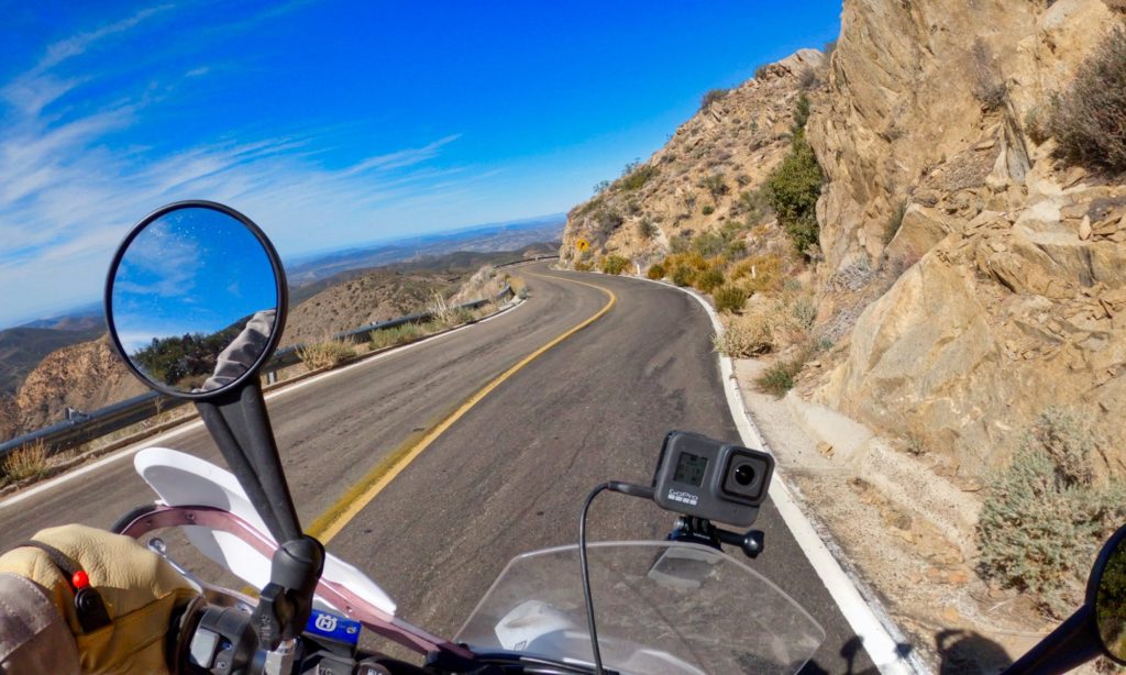 Motorcyclist on road down from mountain in Baja Mexico